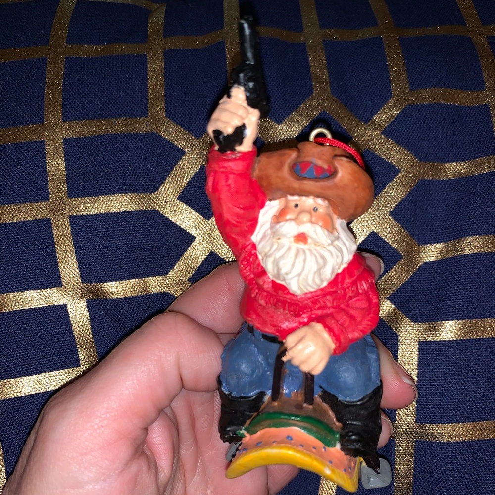 Cowboy Santa on saddle with gun Ornament
